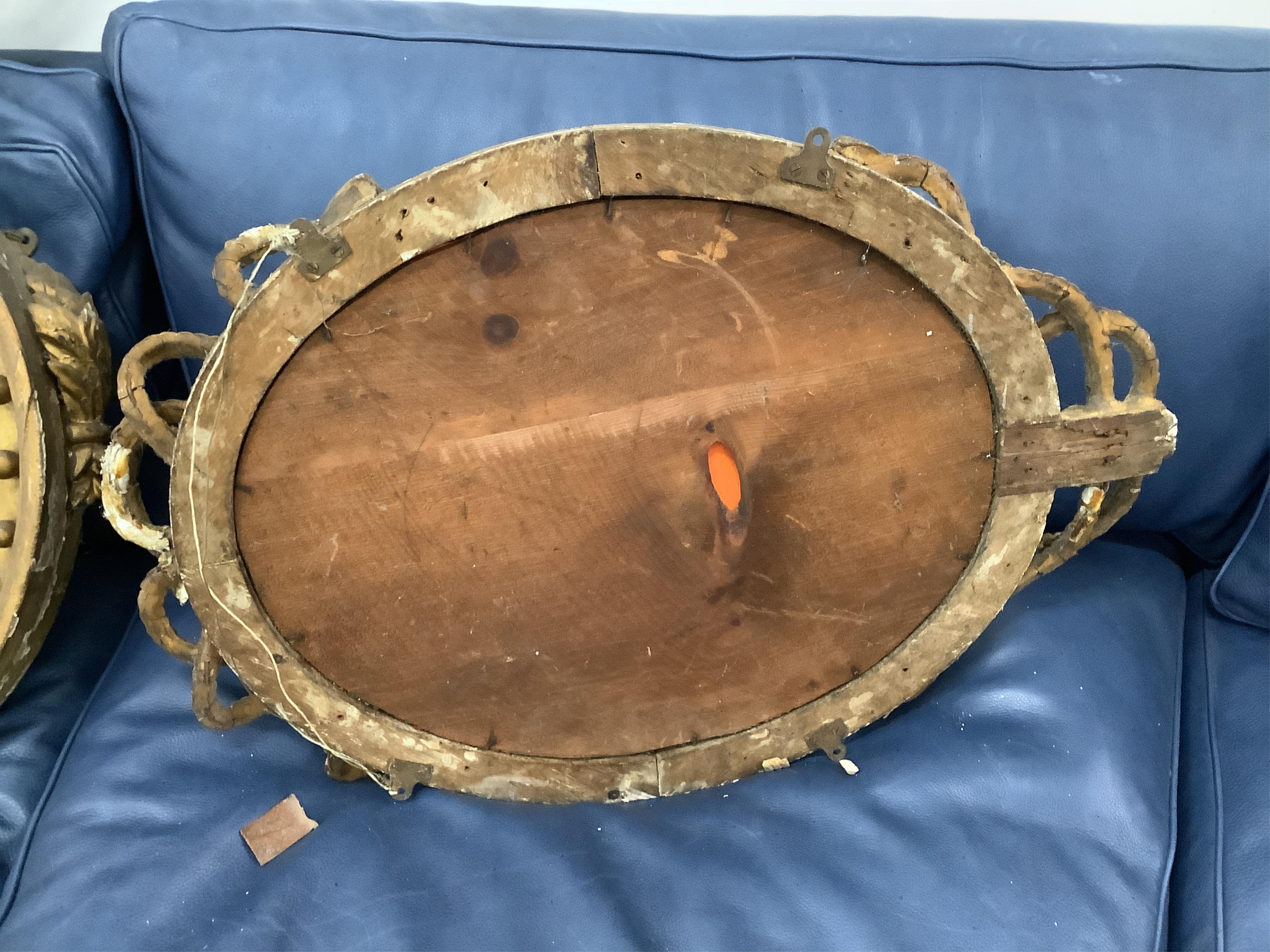 A Regency circular giltwood convex wall mirror with lion pediment, diameter 65cm a Regency convex mirror frame and Victorian girandole. Condition - poor